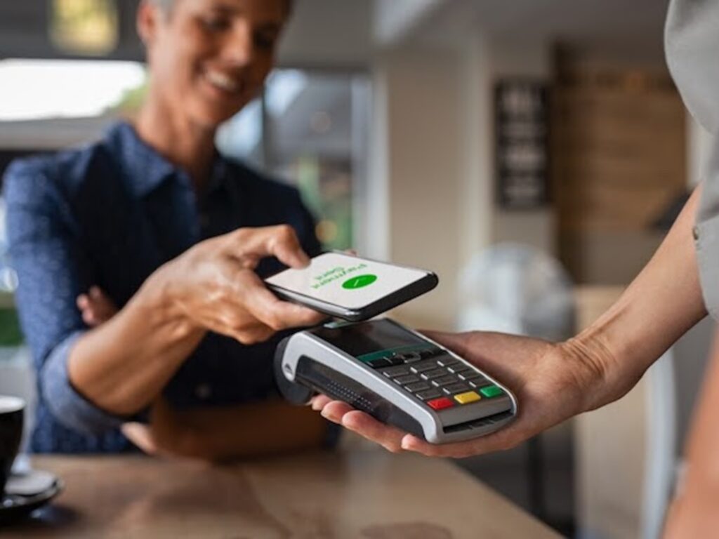 Using Apple Pay contactless payment at a restaurant in Buenos Aires, Argentina.